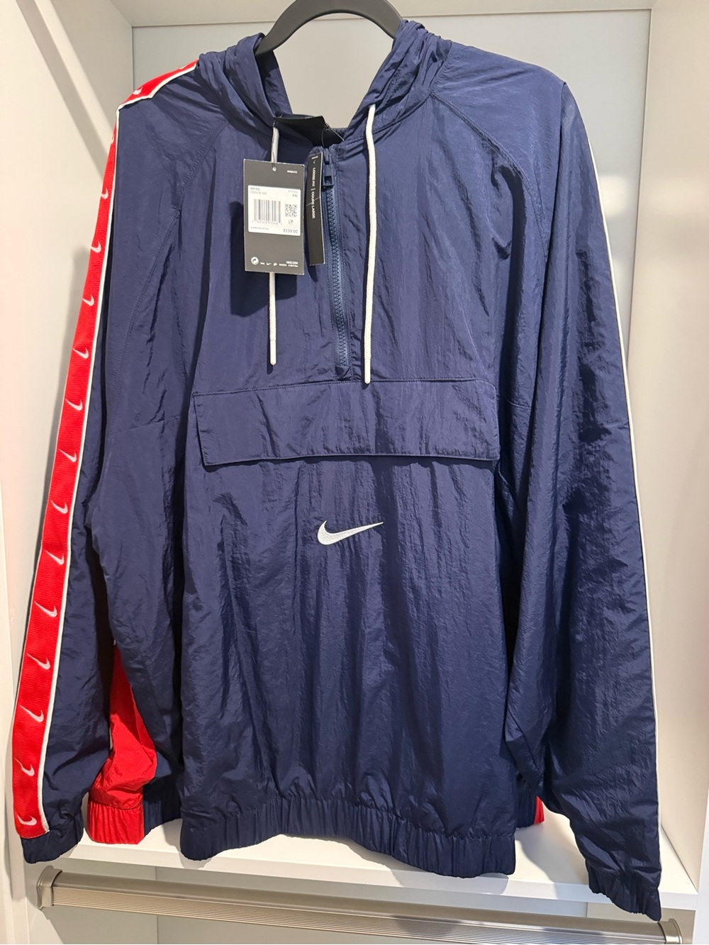 Nike Navy Hooded Windbreaker with White Swoosh and Red Stripe Detail